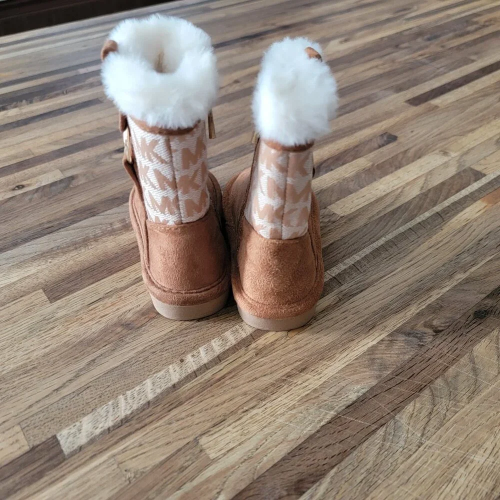 Michael Kors Yancy Girl Toddler boots featuring a brown logo print and faux fur